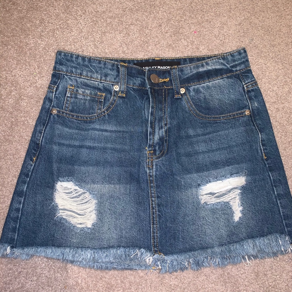 Distressed denim mini skirt